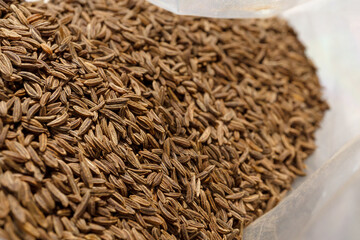 Close-up of cumin seeds in a bag