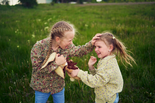 sisters fight over a toy bunny