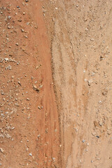 Top-down view of sandy ground dried after rain