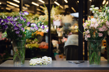 Florist workplace background, glasses transparent vases for bouquet in flower shop