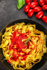 Pasta tagliatelle tomato sauce second course tasty food dish fresh delicious gourmet food background on the table rustic food top view copy space