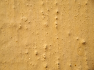 Abstract​ yellow color of​ surface​ wall​ concrete​ for​ vintage​ background. ​texture​ damaged​ to surface​ wall. Wall​ texture​ for​ background.