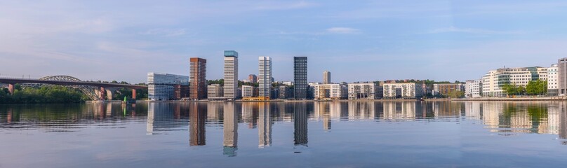 Panorama, skyscrapers apartment houses, the train bridges over the island at the &Aring;rstaviken, sunny summer morning in Stockholm