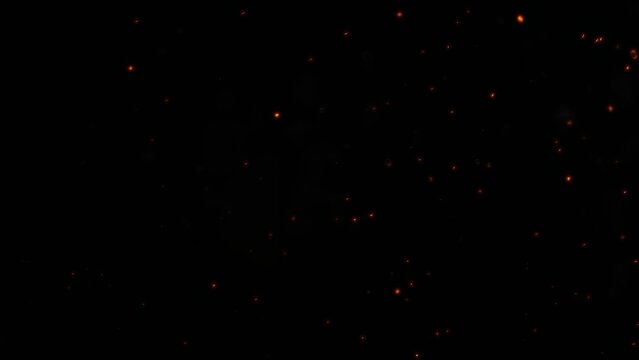 Glowing particles resembling embers from a fire, scattered against a black background, creating a dynamic and warm fiery atmosphere.