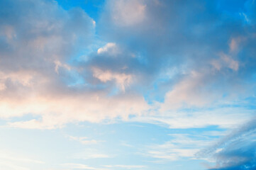 Sunset sky background, dramatic sunset sky in scenic tones, vast panoramic sunset sky with beautiful clouds