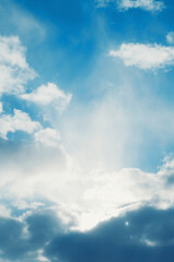 Obraz premium Blue sky background, scenic blue sky in colorful tones, vast panoramic blue sky with fluffy clouds and rays of light