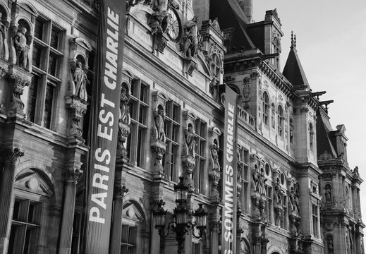 Paris, France - January 17, 2015: Parisian City Hall (Hotel de Ville) with memorial banners "Paris est Charlie" and "Nous sommes Charlie"  following the terrorist attack on Charlie Hebdo magazine. 