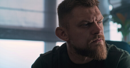 Obraz premium Close up of depressed military man with contusion or PTSD crying during rehabilitation after war or counseling session. Soldier talks to psychotherapist or psychologist. Post traumatic stress disorder
