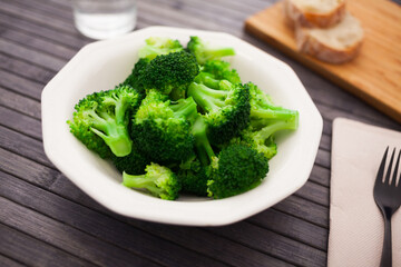 Diet food. steamed broccoli on plate