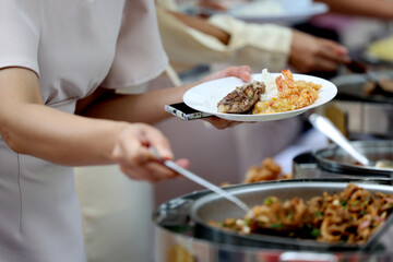 Food Buffet Catering Dining Eating Party Sharing Concept.people group catering buffet food indoor in luxury restaurant with meat colorful fruits and vegetables