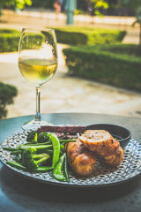Roasted Chicken Roulade Roasted sweet potatoes, steamed green vegetables, chimichurri sauce .