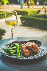 Roasted Chicken Roulade Roasted sweet potatoes, steamed green vegetables, chimichurri sauce .