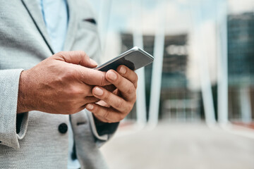 Smartphone, business and hands closeup in city for travel app, commute or check email. Mobile tech, typing and person outdoor for research, scroll or urban planner review plan for development project
