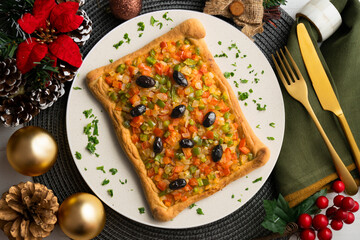 Coca de trampo mallorca with vegetables. Top view table with christmas decorations.