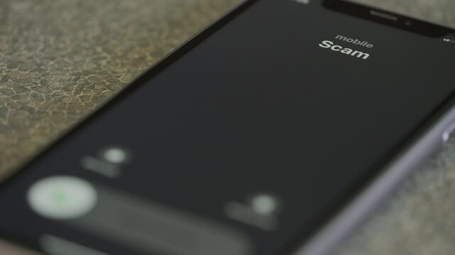 Incoming scam call on smartphone macro video.