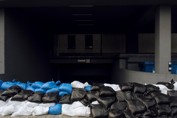Wall of sandbags protecting underground parking in Poland