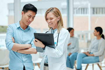 Fototapeta premium People, doctor and happy with patient on file with results, report and feedback on health progress at clinic. Hospital, medical professional and smile on folder for good news or healing on diagnosis