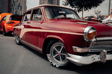 Sporting a deep maroon color and classic white-wall tires, this vintage car brings back the charm...