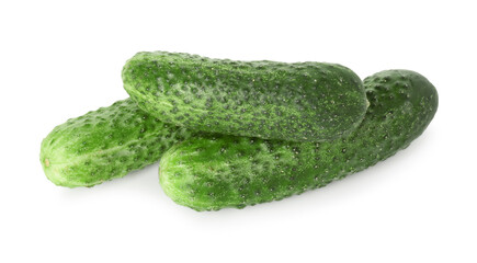 Three whole fresh cucumbers isolated on white