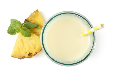 Tasty pineapple smoothie in glass, slices of fresh fruit and mint isolated on white, top view