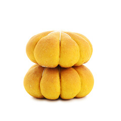 Stack of tasty pumpkin shaped buns isolated on white
