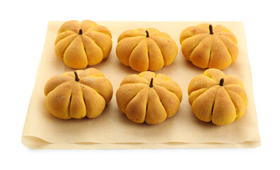 Parchment with tasty pumpkin shaped buns isolated on white