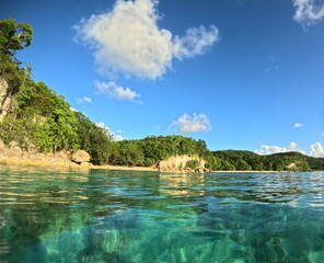 anse canot in evening light seen from the turquoise sea with copy space, caribbean beach in Saint...
