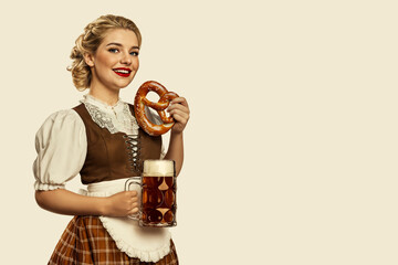 Bavarian woman enjoying a pretzel and beer stein, dressed in traditional attire against a beige background
