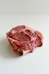 Fototapeta premium Freshly cut raw meat sits on a clean table, perfect for food preparation or photography props