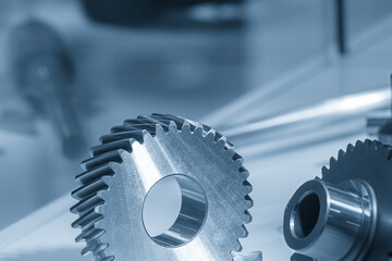 Close up the transmission  gear spare parts in the light blue scene.