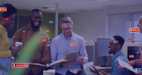 Image of social media icons with texts over diverse colleagues having meeting in office