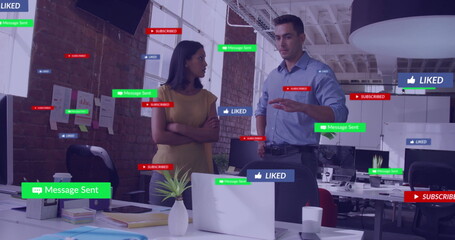 Image of social media icons with texts over diverse colleagues discussing work in office