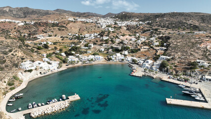 Fototapeta premium Aerial drone photo small port of Psathi untouched by tourism built below picturesque hora of Kimolos island, Cyclades, Greece