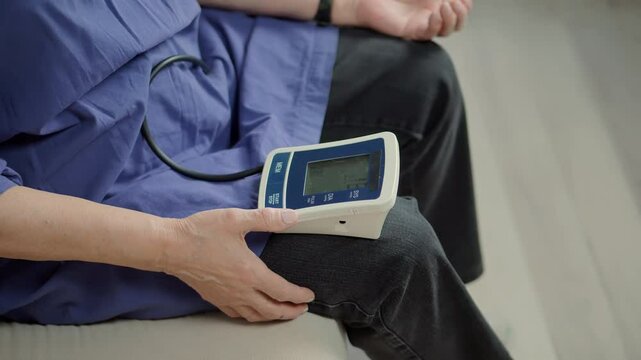 Woman checking blood pressure hypotension diagnostic on medical tonometer	