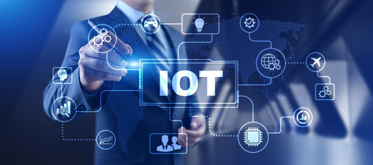 IOT internet of things innovation technology concept. Businessman pressing button on screen.