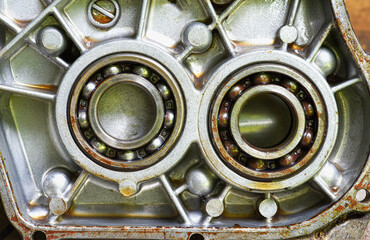 ball bearing  are  installed in the gearbox housing  of  a small  four-stroke engine  