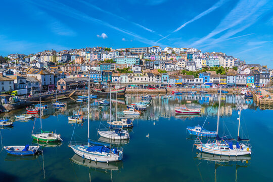 Brixham Devon beautiful harbour with boats with blue sky England UK