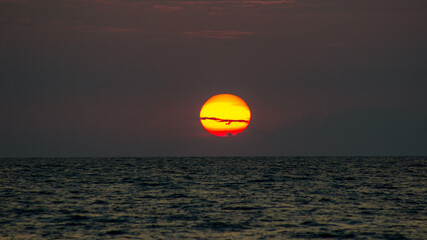 Summer sunset on the Black Sea. Waves in the sun light.