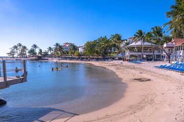 The sandy beach of a tropical Caribbean resort