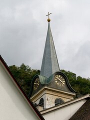 View of the church tower between two roofs
