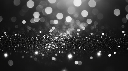 Silver sparkles on a black background close-up