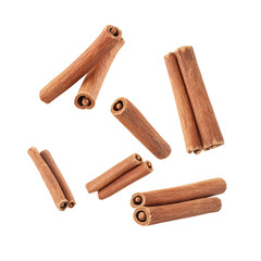 Cinnamon sticks isolated on white background. Aromatic spice commonly used in cooking and baking. Close-up of fragrant cinnamon.