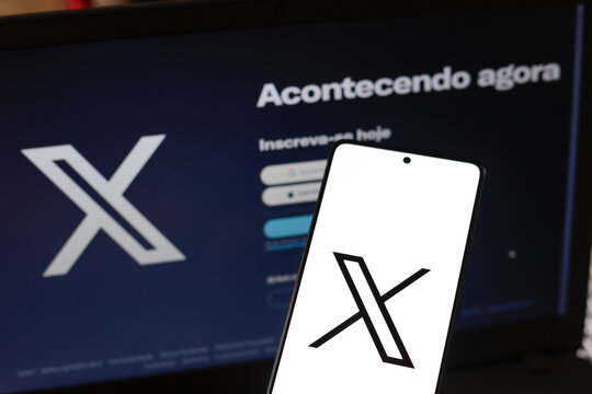 September 19, 2024, Brazil. In this photo illustration, the X logo (formerly Twitter) is displayed on a smartphone screen and on a notebook screen.
