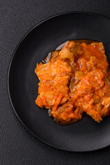 Sliced fish in tomato sauce with salt and spices