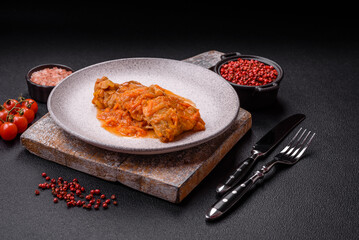 Sliced fish in tomato sauce with salt and spices