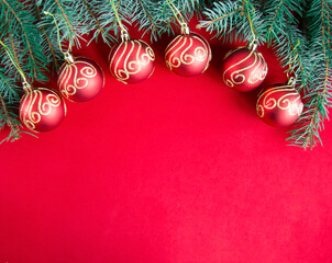 Christmas decorations on red background, flat lay. Space for text.