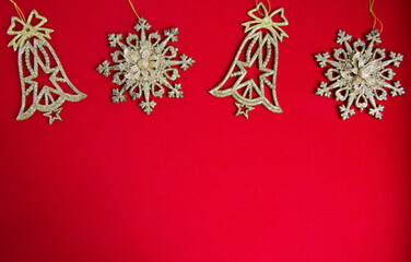 Christmas decorations on red background, flat lay. Space for text.