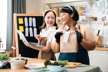 Joyful Cooking Moments, Asian Woman in Apron Prepares Delicious and Fresh Food in Her Kitchen, Smiling Cheerfully as She Embraces a Healthy Lifestyle, Baking Sweet Treats and Creating at Home