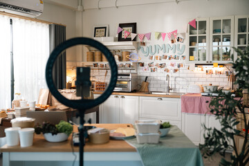 Kitchen Live Streaming, Asian Woman Cooks Fresh Vegetables and Prepares Delicious Meals Using Technology, Sharing Recipes and Culinary Tips on Her Blog with Smartphone, Embracing a Vibrant Lifestyle
