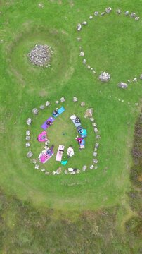 Aerial view of a group of women worshipping at the Beaghmore Stone circles at Blackrock Road by Cookstown in County Tyrone, Northern Ireland